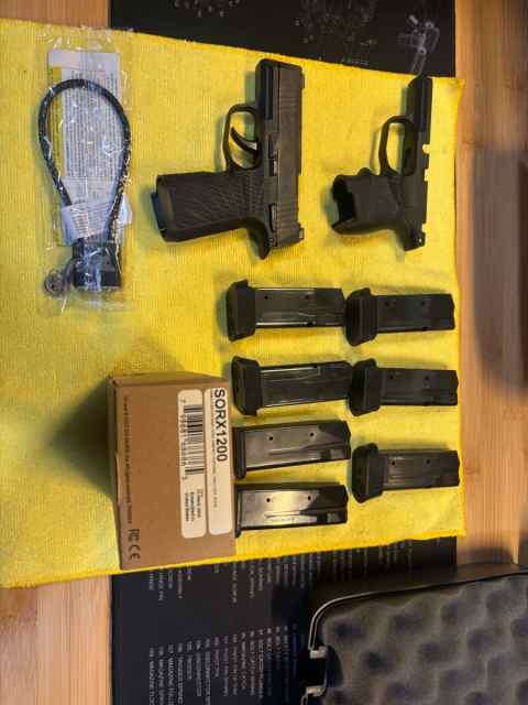 Sig P365 with Wilson Combat Grip plus the Original